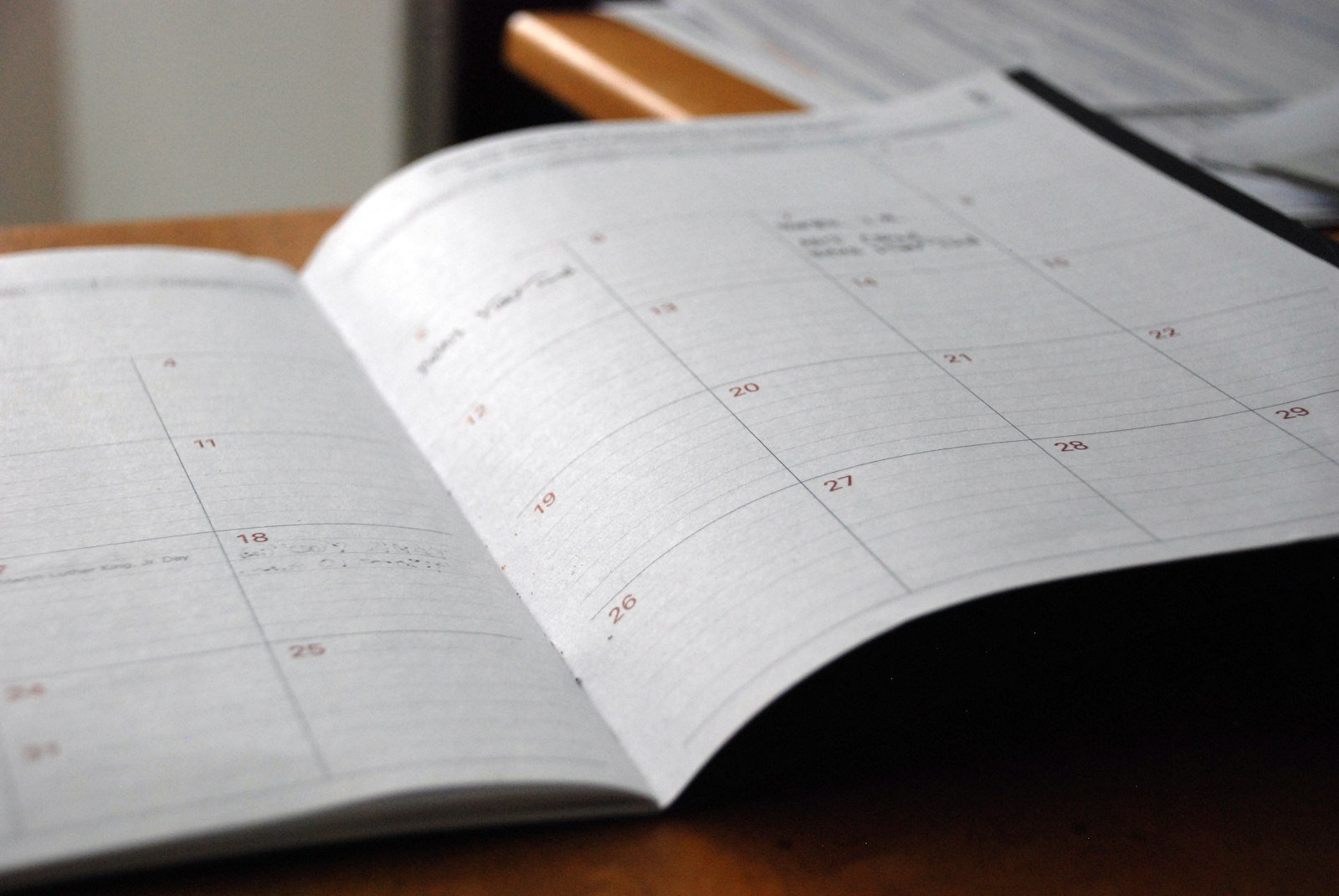 Open planner on a desk representing a content calendar serving two audiences