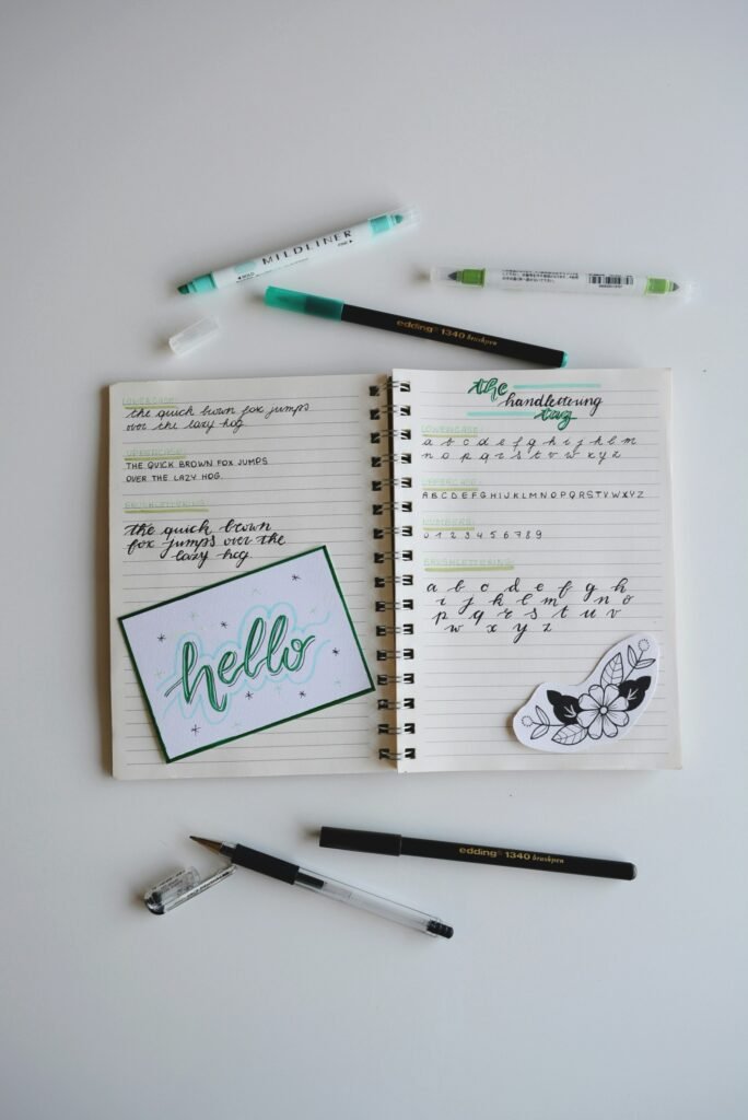Writing desk flatlay with notebook and pen, representing content depth vs content volume in SEO