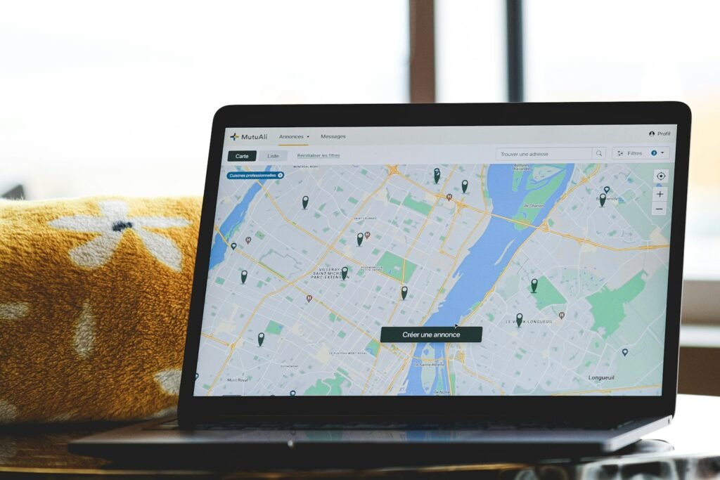 Laptop displaying a world map, symbolizing copywriting for both Nigerian and American readers