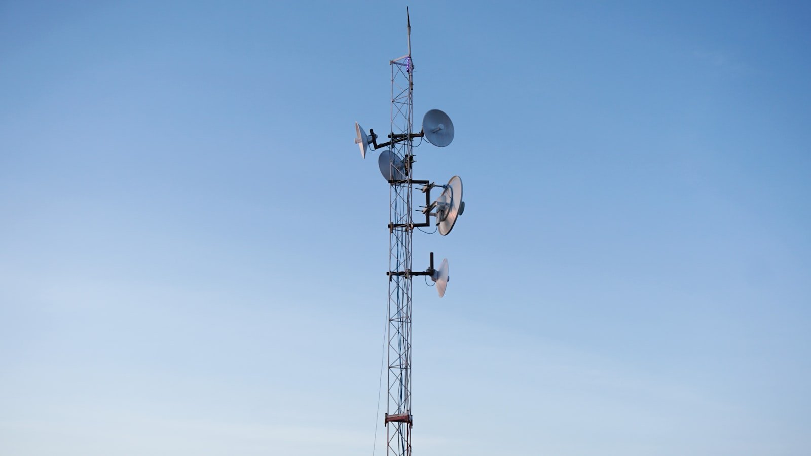 Cell phone tower representing mobile network connectivity differences between Nigeria and the US