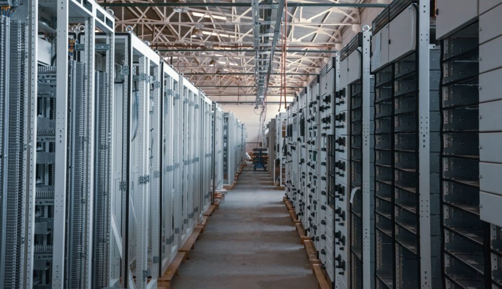 Server room aisle with equipment racks, representing deploying a Next.js app