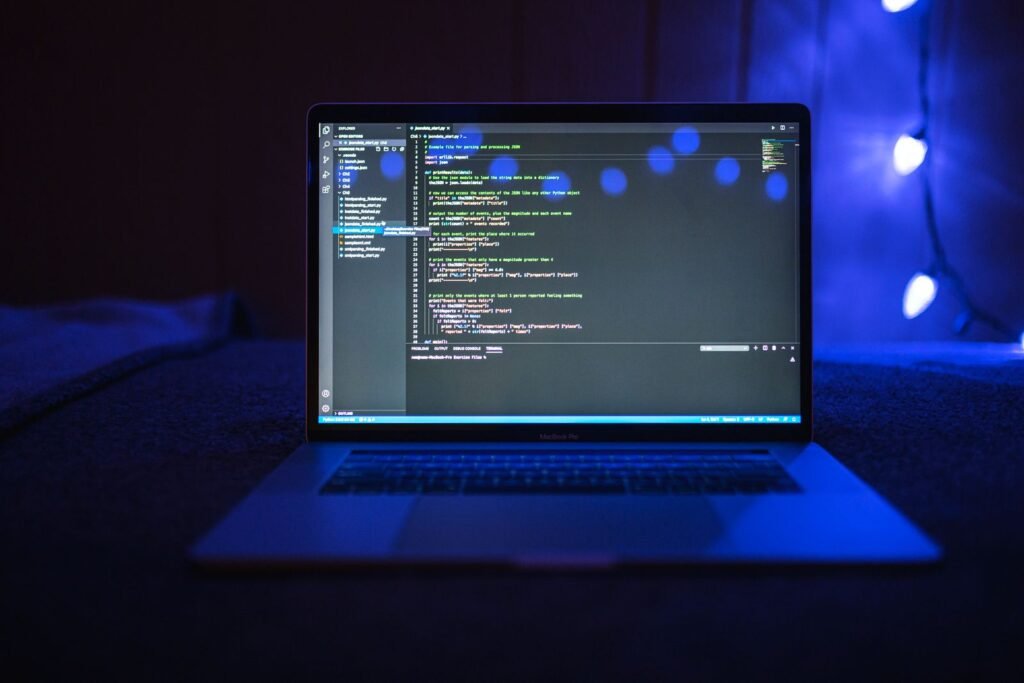 JavaScript code on a laptop screen illustrating the event loop and asynchronous execution