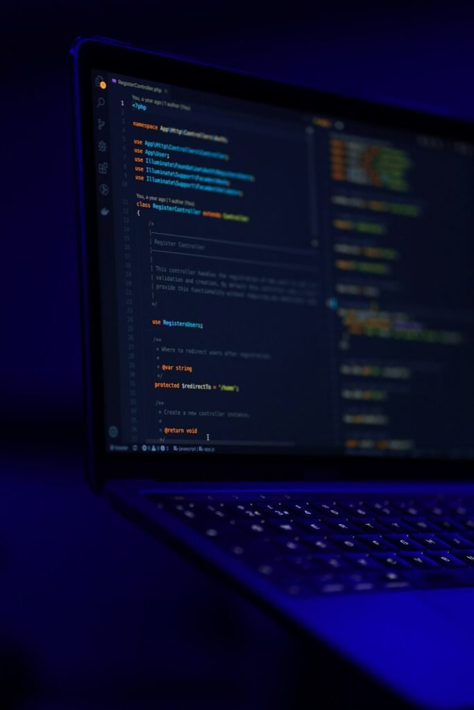 Black laptop screen displaying JavaScript object code