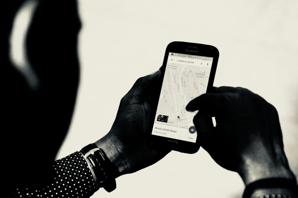 Hand holding a phone checking a location on Google Maps, representing local search behavior