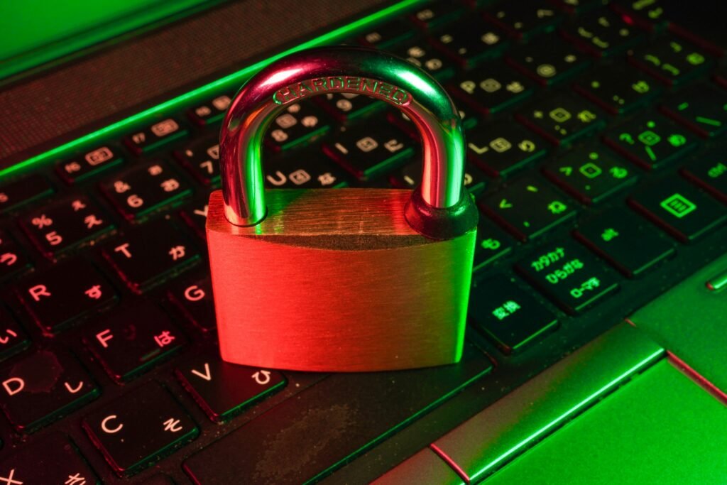 A red padlock resting on a black computer keyboard, symbolizing an unpatched React security vulnerability