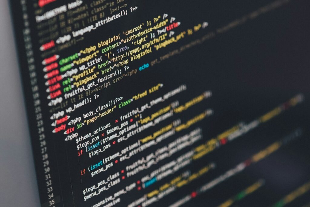 Computer monitor displaying code representing React components, props, and state