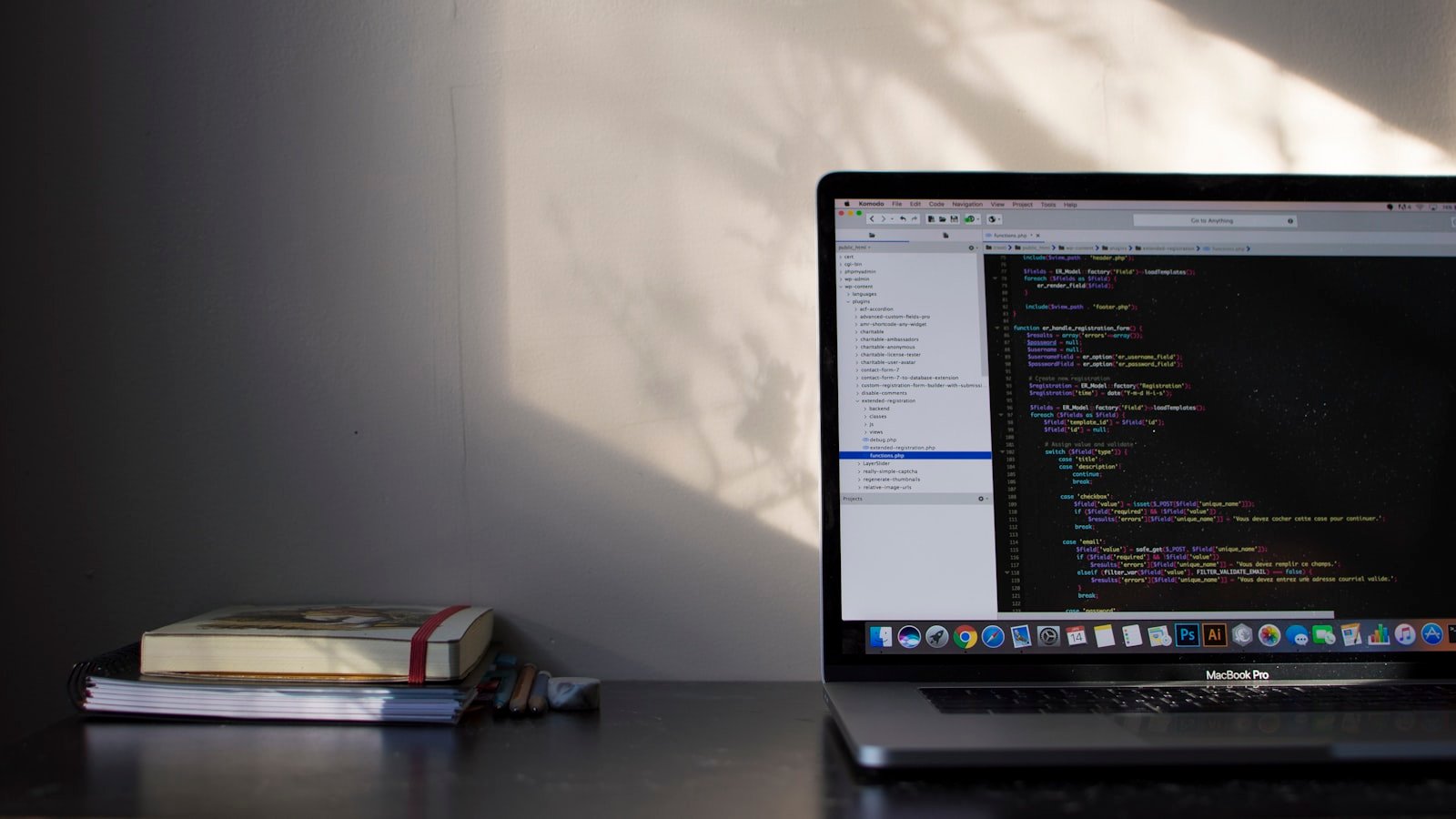 MacBook Pro displaying code representing React hooks