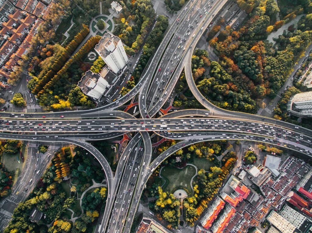 A pole with multiple street signs pointing in different directions, representing routing in a multi-page React app