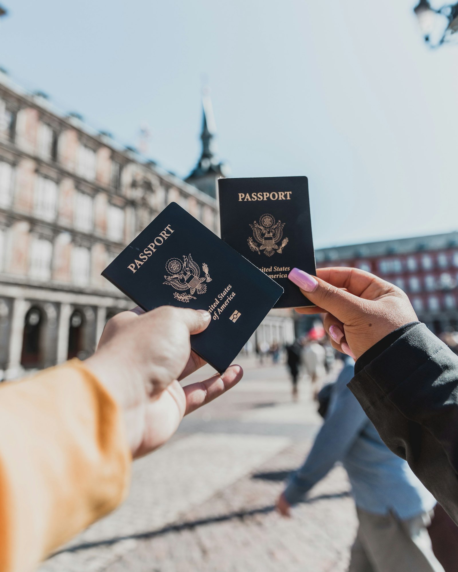 Person holding passports representing immigration and visa consulting services