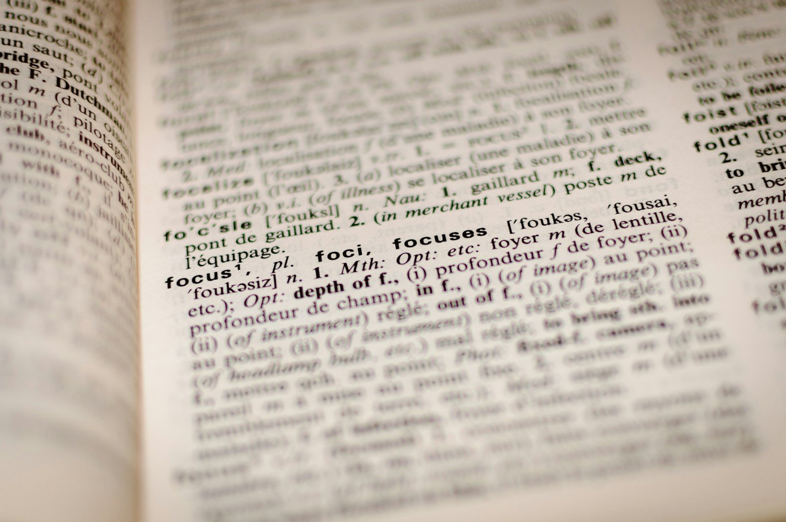Open dictionary page representing US and Nigerian English spelling differences