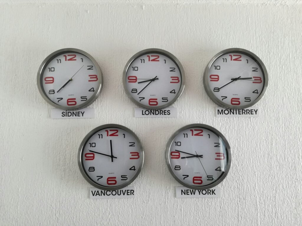 Assorted wall clocks showing different country time zones