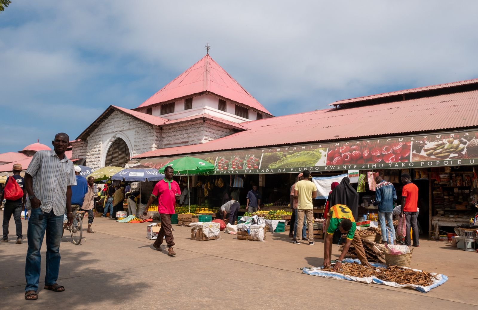 Busy African street market scene, representing everyday mobile-first commerce