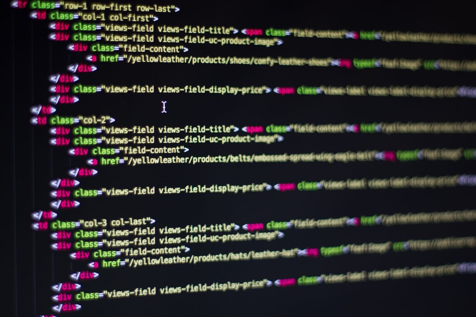 HTML markup on a computer monitor representing custom WordPress theme code