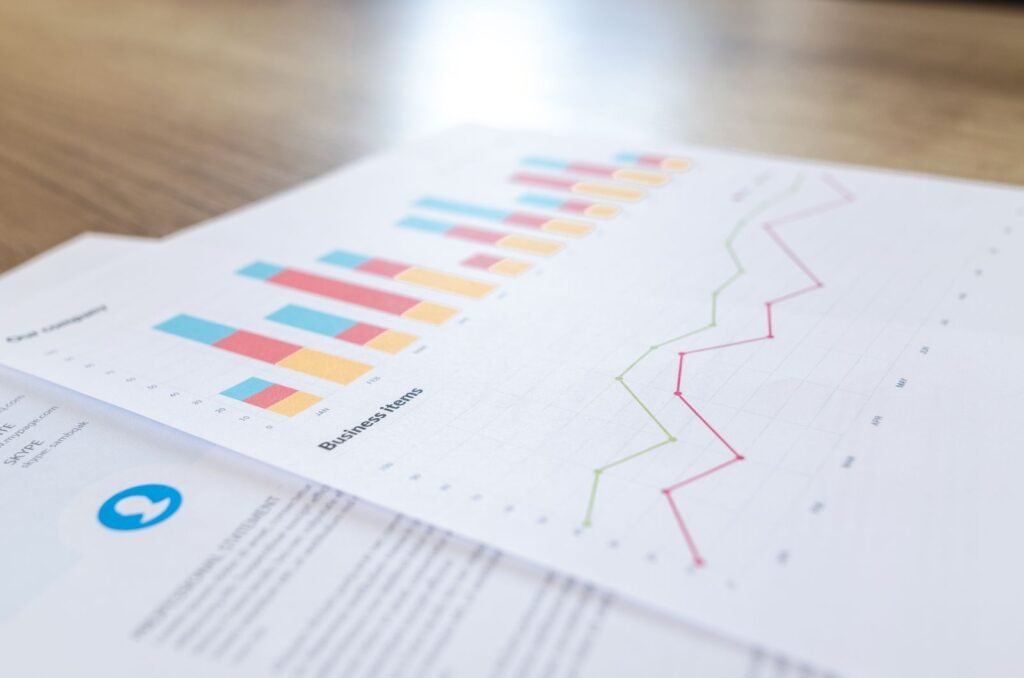 Business charts and graphs showing a website traffic trend on a desk