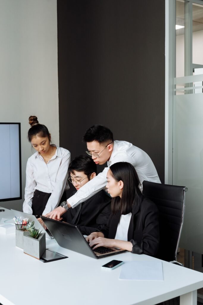 Team reviewing a web design project in a Lagos office