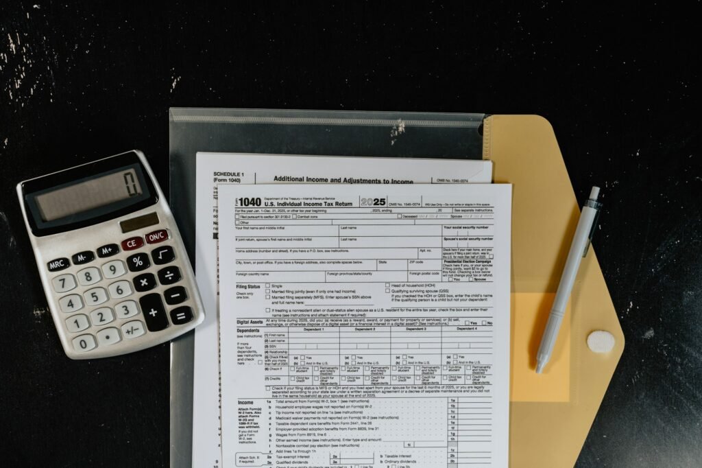 Calculator and paperwork on a dark surface, representing how much SEO costs in Nigeria