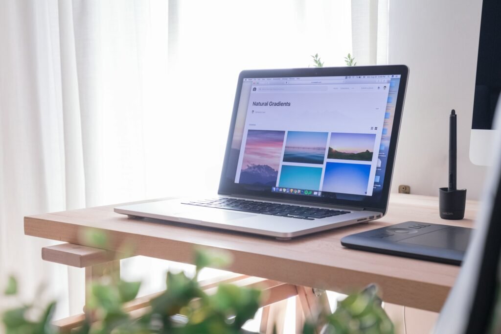 Opened laptop on a wooden desk, representing WordPress vs Wix vs Squarespace for a Nigerian small business